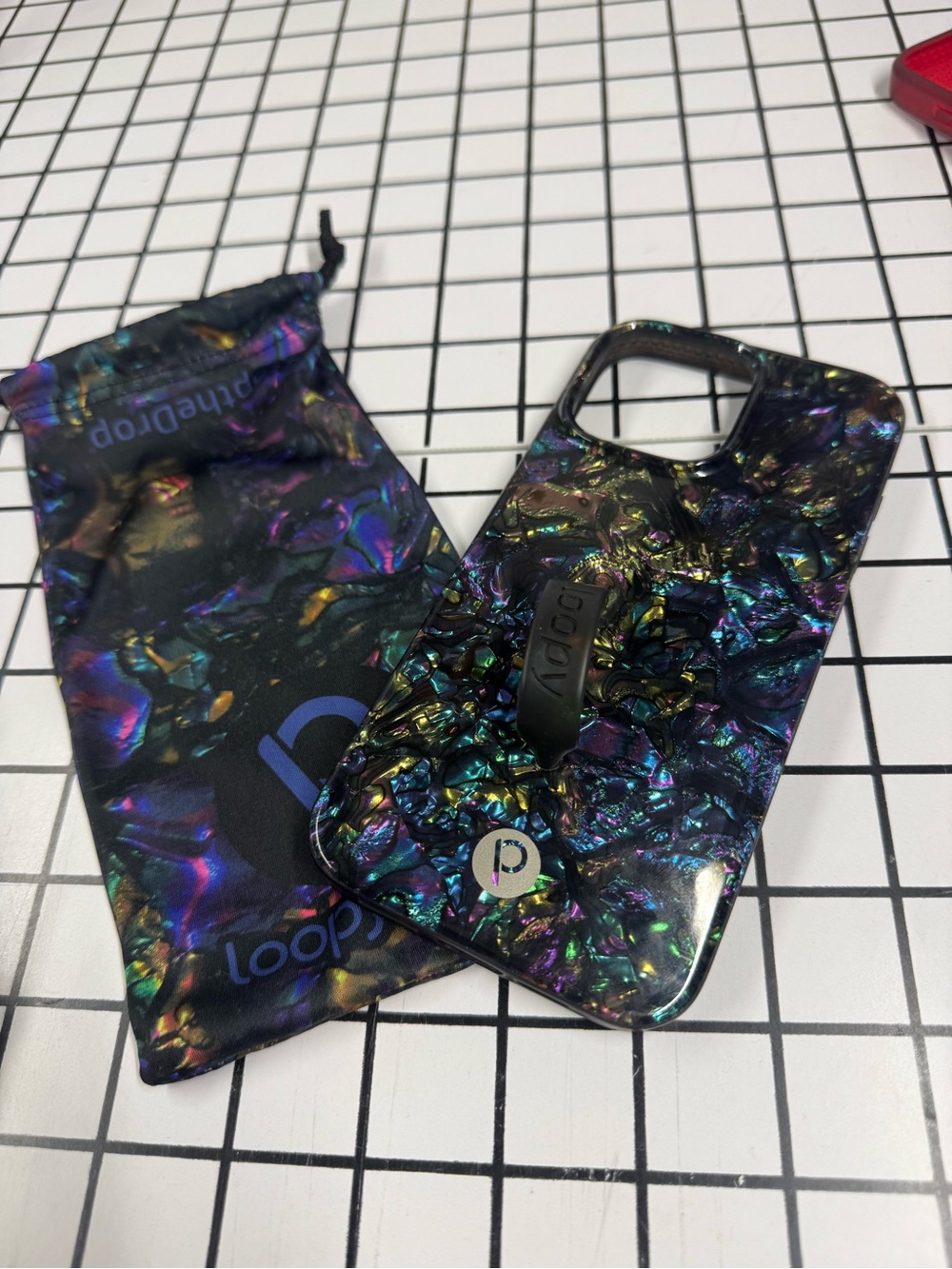 Iridescent Multicolor Loopy Phone Case with Right Handed loop iPhone 16 pro max